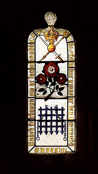 Stained glass window showing Tudor Roses & Portcullis