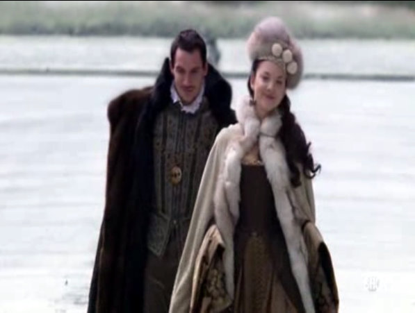 Anne out on a winter walk with Henry in her brown gown and fur cloak and matching hat