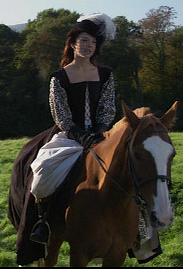 Natalie Dormer as Anne Boleyn riding astride