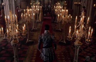 Henry walks to his wedding with Anne of Cleves surrounded by candleabras