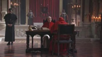 The Pope sits at his table